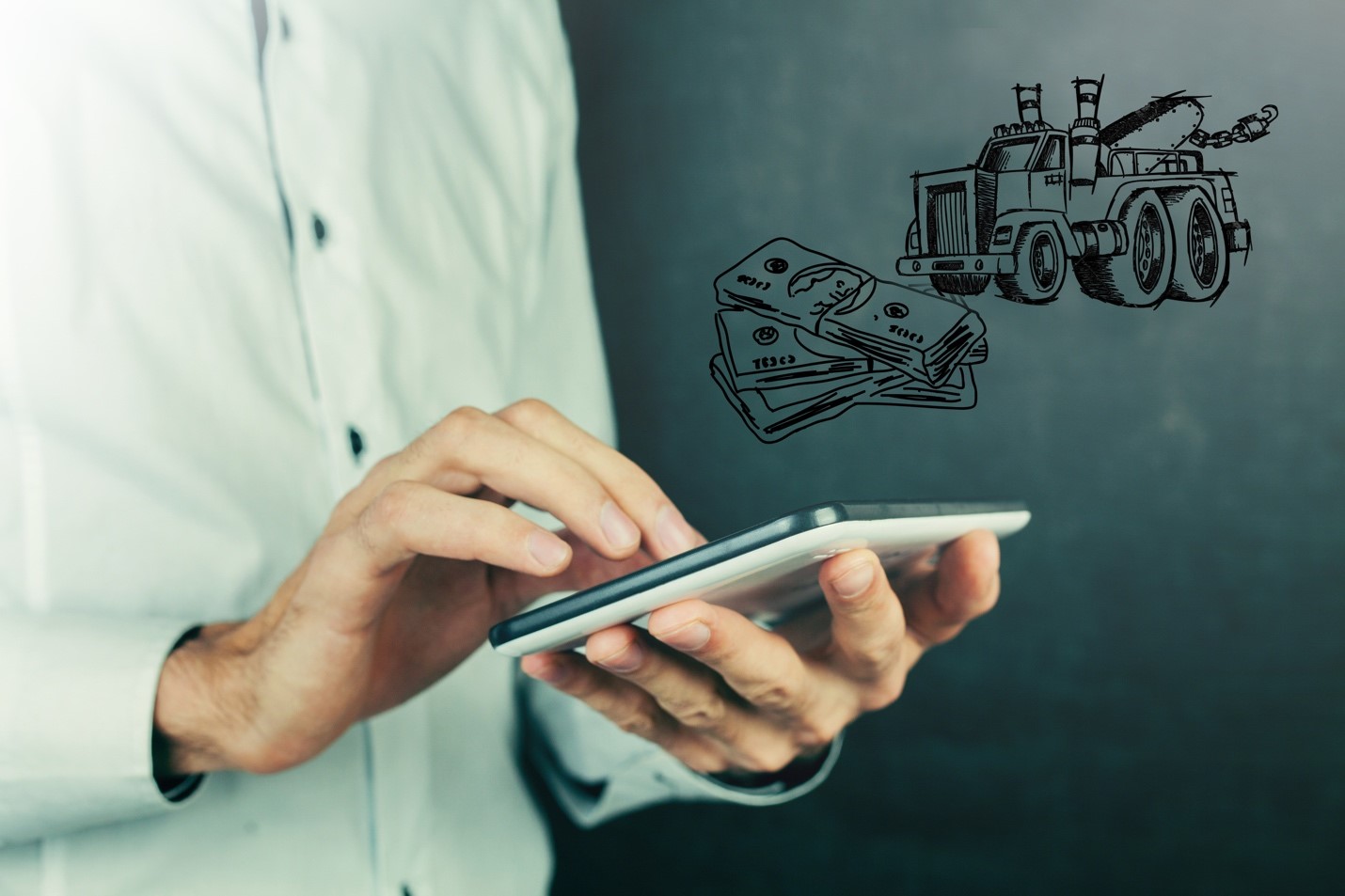 A man holding an ipad in front of a drawing of a truck.