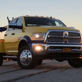 A yellow truck is parked on the street